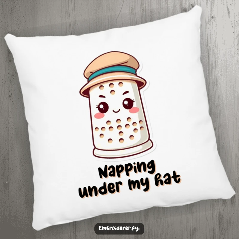 Funny anthropomorphic thimble wearing a tiny hat on a plush pillow, bringing determination and stylish comfort, ideal for funny pillow lovers.