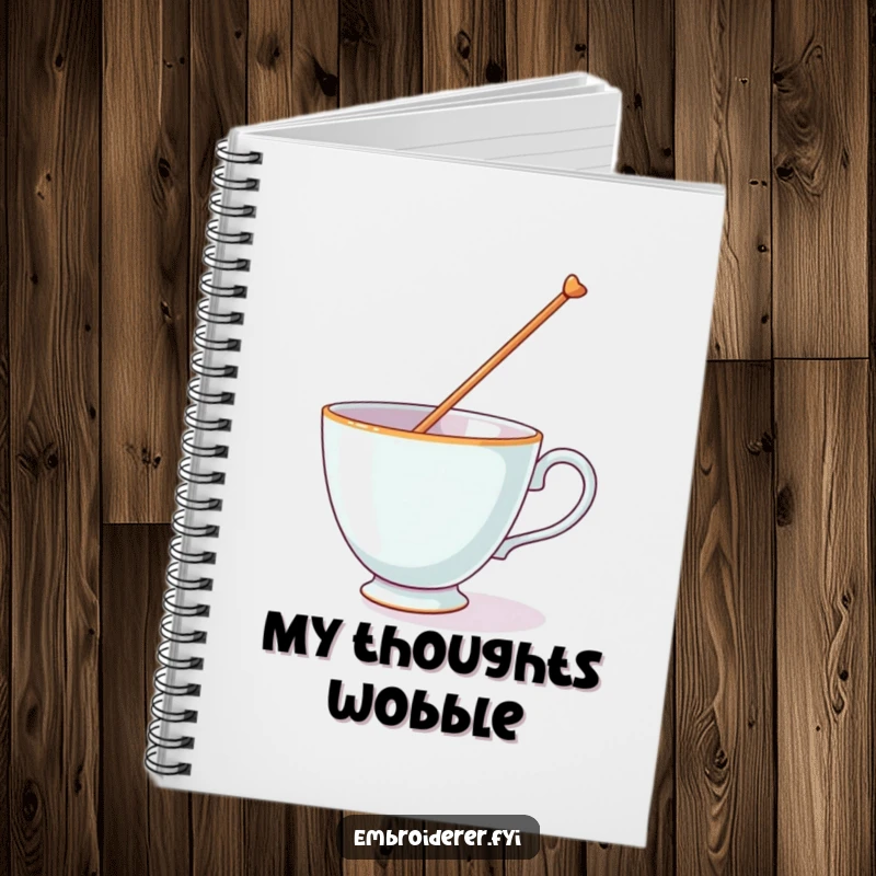 Funny notebook with a teacup balancing a giant needle, inspiring creativity with a humorous visual.