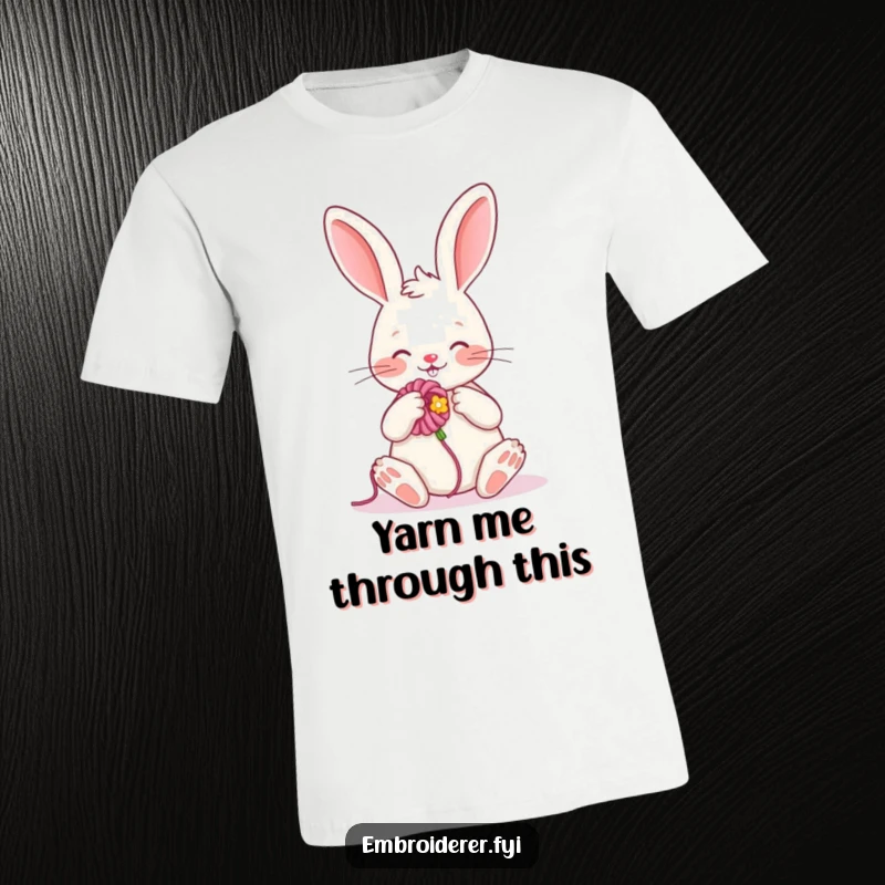 Funny t-shirt depicting a cheerful rabbit enthusiastically embroidering a flower, showcasing a passion for crafts and cuteness.